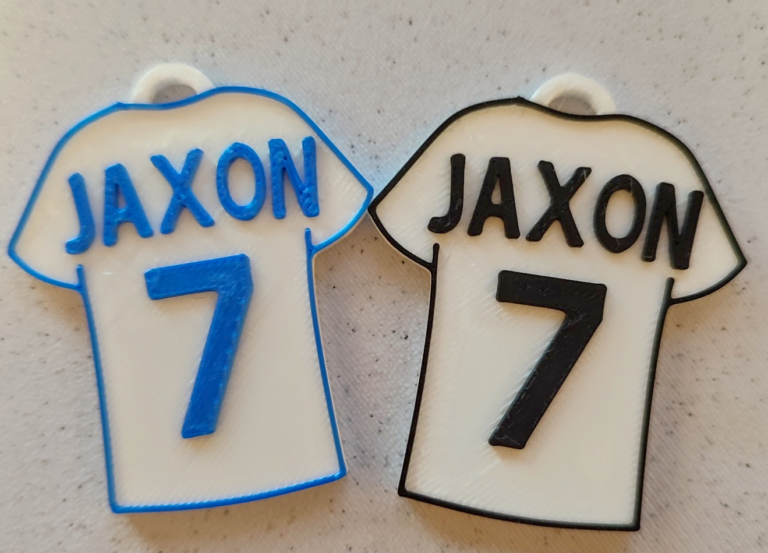 Two genuine EZGift football shirt keepsakes photographed together